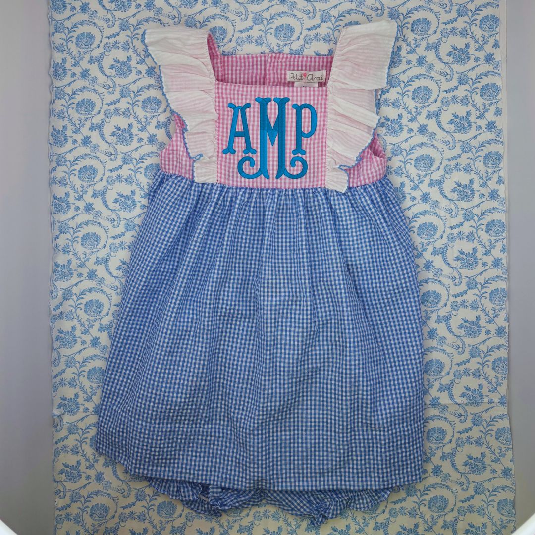 This "Big Sister" dress features playful ruffle sleeves and comes with a matching diaper cover. Plus, there's room for custom embroidery, making it a unique and personalized option for your child's wardrobe. Perfect for special occasions or everyday wear. Pair it with the popover for little sister and the seersucker romper for little/big brother! 