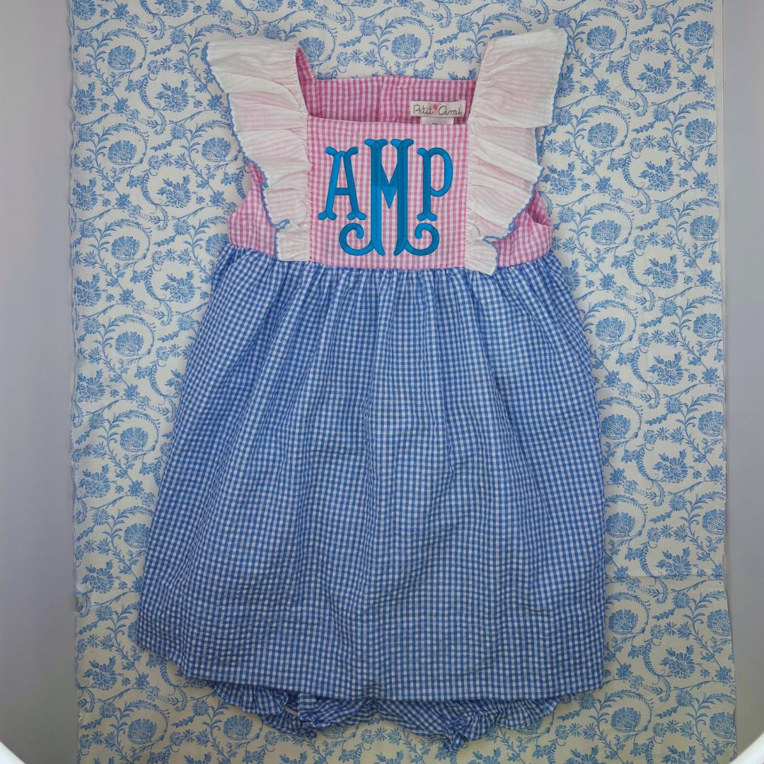 This "Big Sister" dress features playful ruffle sleeves and comes with a matching diaper cover. Plus, there's room for custom embroidery, making it a unique and personalized option for your child's wardrobe. Perfect for special occasions or everyday wear. Pair it with the popover for little sister and the seersucker romper for little/big brother!&nbsp;