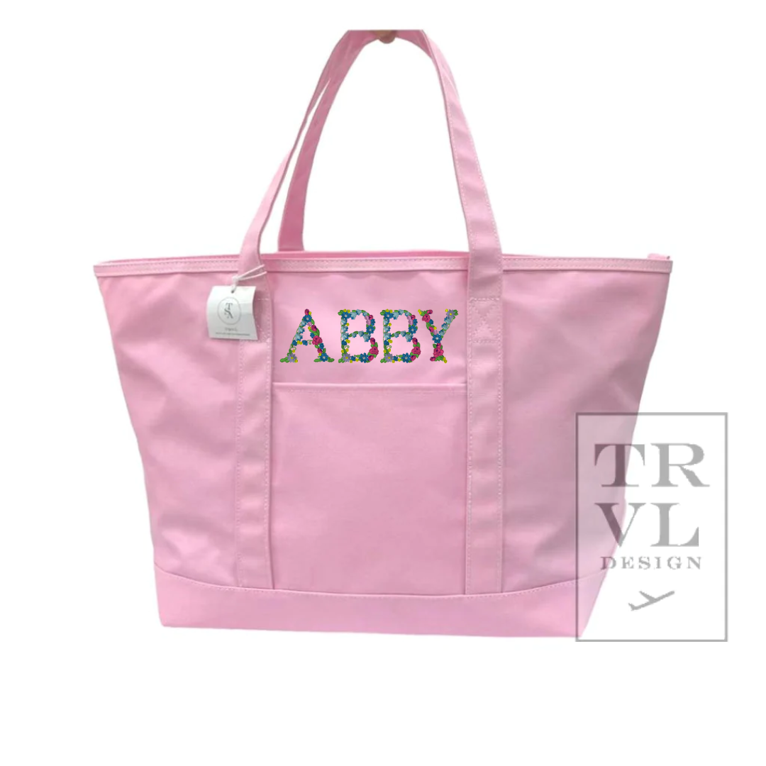 Our new Maxi Tote in coated canvas is perfect for day-to-day, beach, groceries, and getaways. This roomy interior can carry a 17” laptop, change of clothing and our other TRVL accessories. Designed with double shoulder straps, front exterior pocket.