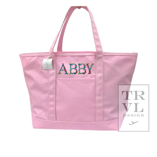 Our new Maxi Tote in coated canvas is perfect for day-to-day, beach, groceries, and getaways. This roomy interior can carry a 17” laptop, change of clothing and our other TRVL accessories. Designed with double shoulder straps, front exterior pocket.